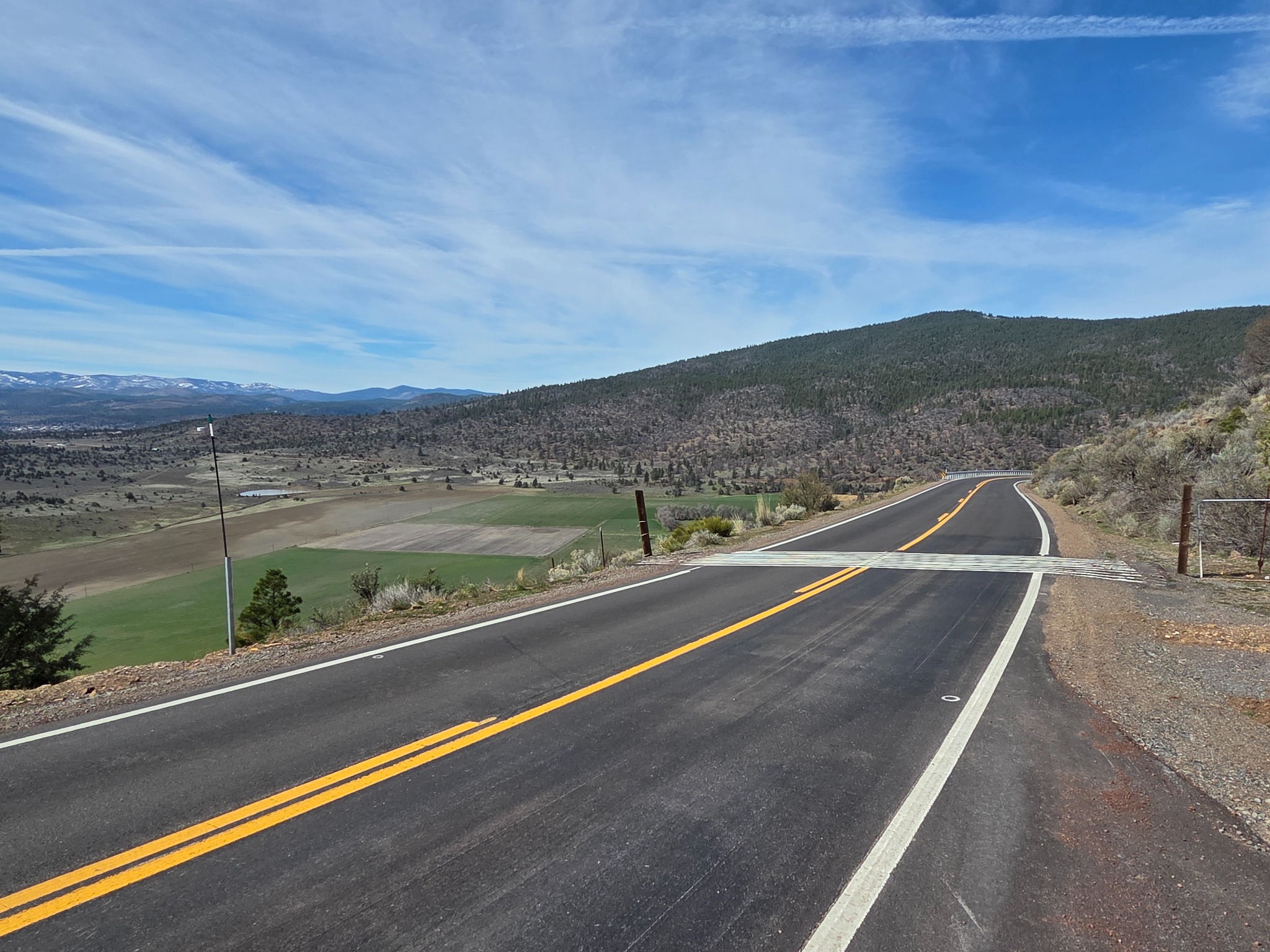 Open highway through a mountain valley used to illustrate nationwide vehicle transport